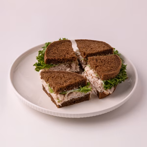 Turkey breast, mayonnaise, lettuce, salt & pepper, on pumpernickel bread