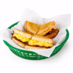 Scrambled eggs, bacon, white American cheese, on white toast*