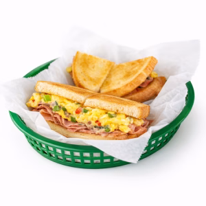 Scrambled egg, ham, green peppers, tomatoes, onions, and white American cheese on white toast.