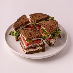 A variation of our traditional double-decker Club made with turkey breast, crisp bacon, Jarlsberg cheese, lettuce & tomato with our mustard sauce and mayonnaise on pumpernickel.
